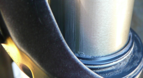 A scratched stanchion due to lack of lubrication and care.